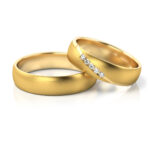 Obrączki ślubne złote półokrągłe z kamieniami diamenty lub cyrkonie