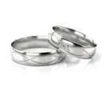 Obrączki ślubne białe złoto fala z kamieniami diamenty lub cyrkonie