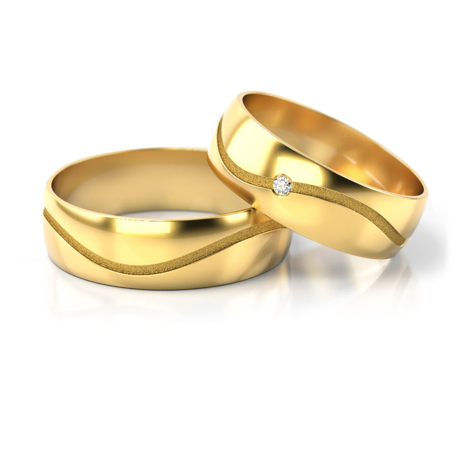 Obrączki ślubne złote półokrągłe z diamentem fala