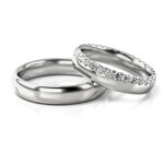 Obrączki ślubne białe złoto półokrągłe z kamieniami dookoła diamenty lub cyrkonie