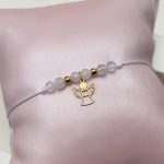 Bransoletka komunijna Komunia Święta na białym sznureczku srebro 925 pozłacane 24kt złotem wiszący aniołek z aniołkiem na Komunię Świętą upominek prezent kamienie księżycowe makrama