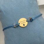 Bransoletka na niebieskim sznurku komunia Święta prezent komunijny srebro pozłacane złocona srebro 925 pozłacana 24kt złotem niebieskie kamienie naturalne akwamaryny pomysł na prezent komunijny dla dziewczynki dla chłopczyka